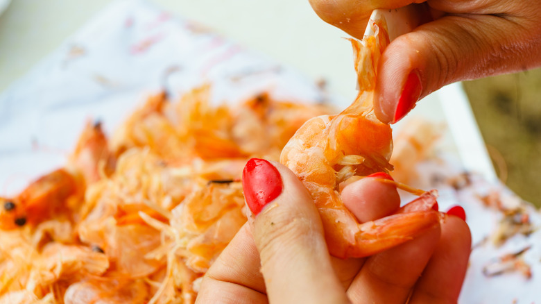 peeling cooked shrimp