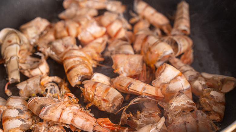 Shrimp shells frying in pan