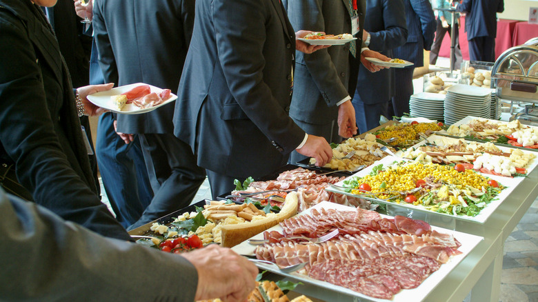 People eating at a buffet