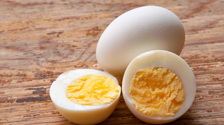 Hard-boiled eggs on wood