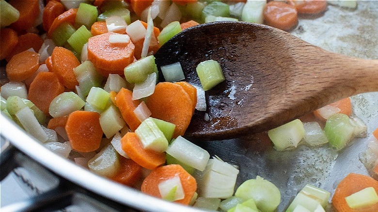 spoon stirring vegetables in pot
