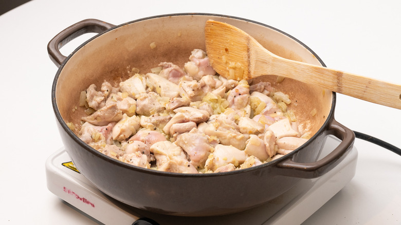 cooking chicken in a pan