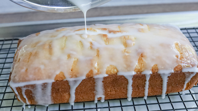 pouring glaze on pound cake