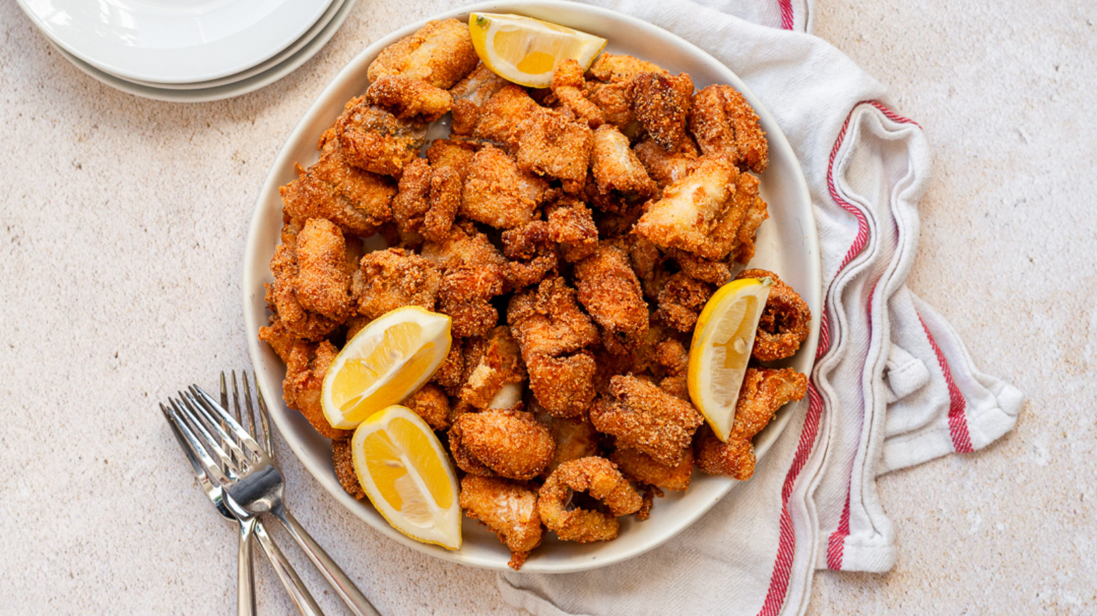 Lemon Makes All The Difference In Your Fried Fish Dishes