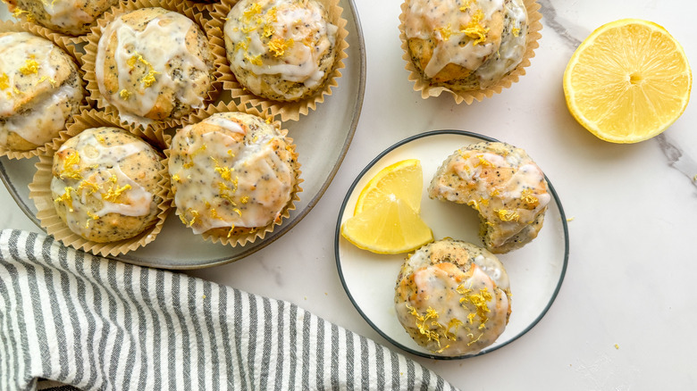 iced lemon poppy seed muffins on plates