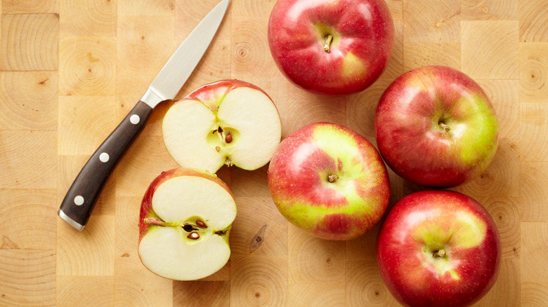 Cut open apples on cutting board 