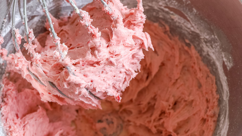 pink frosting in mixing bowl