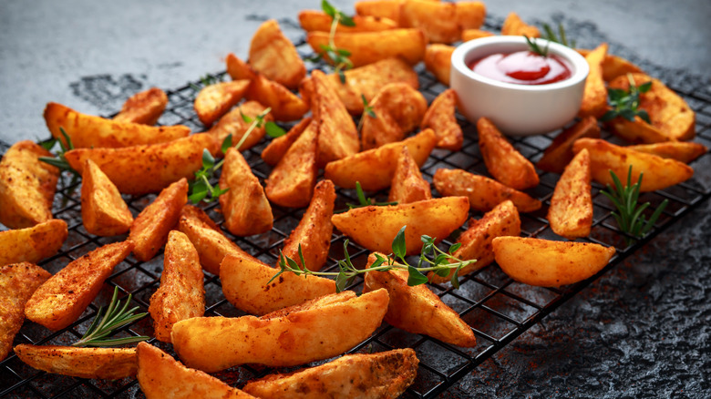 Wedge-cut French fries with ketchup