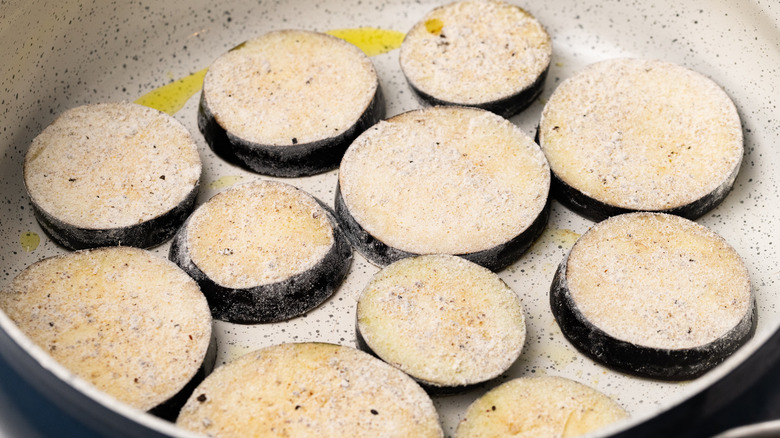 eggplant frying in a pan 