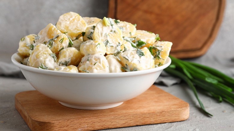 bowl of potato salad with green onions