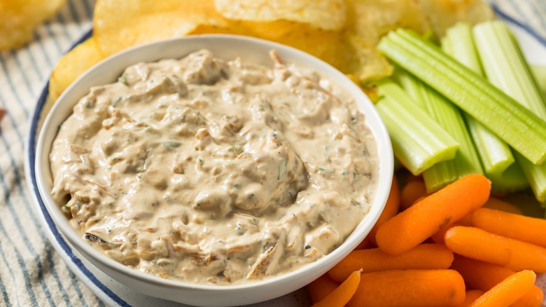 Onion dip, chips, celery, and carrots