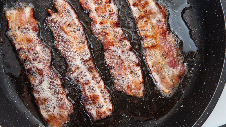 bacon frying in pan