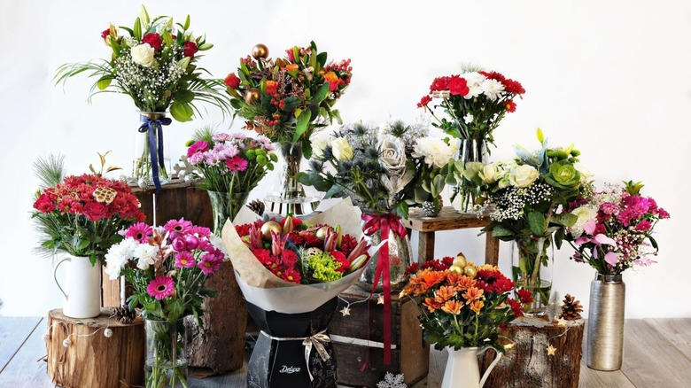 Floral arrangements in a display in different vases