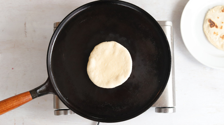 tortilla in black frying pan 