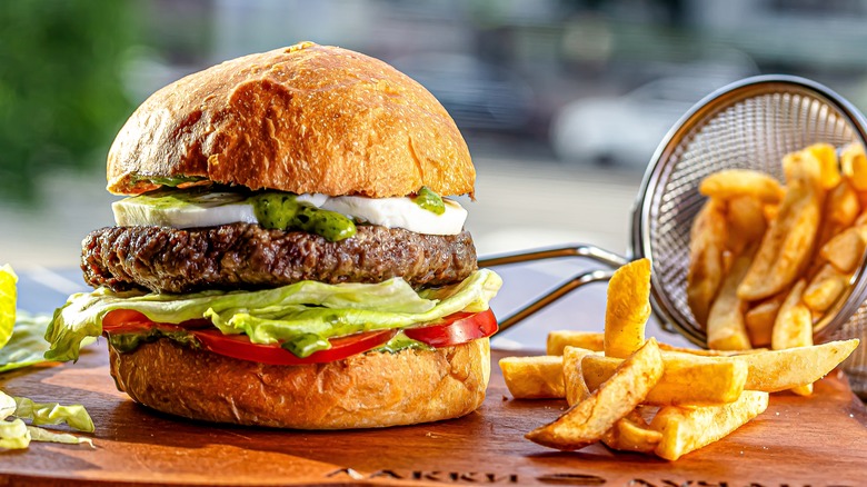 lamb burger with toppings and side of fries