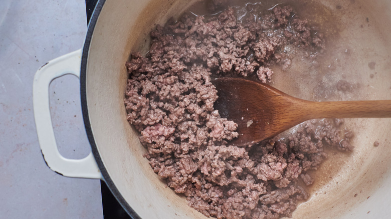 Beef cooking in a Dutch oven