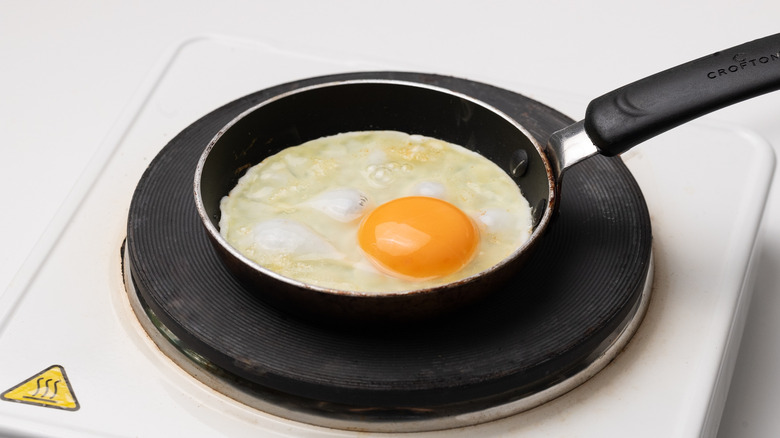 egg frying in pan