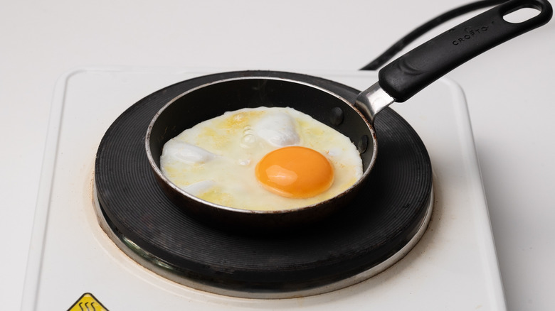 egg frying in pan