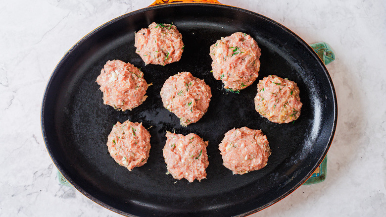 Burgers in a cast-iron pan