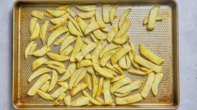 baked fries on baking sheet