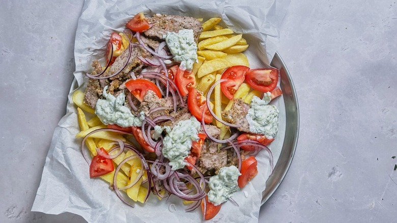 tomato and onion on gyro fries