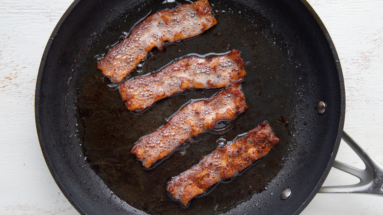 bacon frying in pan