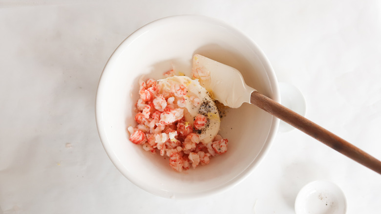 lobster ravioli filling in a bowl with rubber spatula