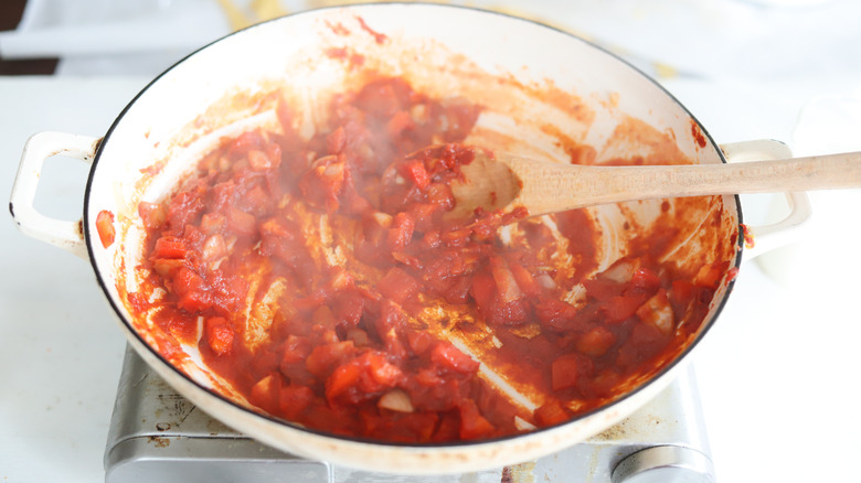 white wine in a pan with tomato paste