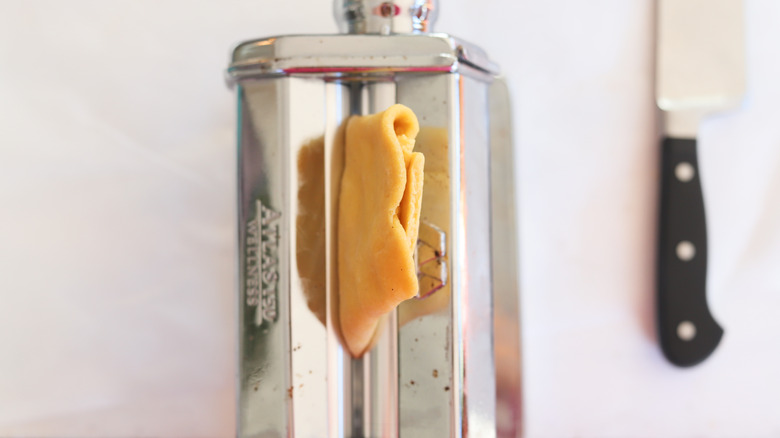 pasta dough in pasta roller