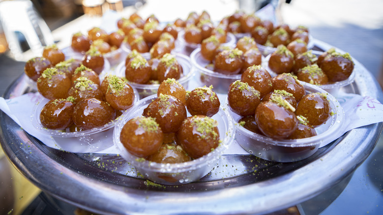 Loukoumades sprinkled with crushed pistachios