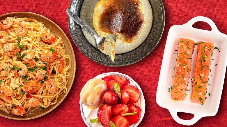 composite of shrimp scampi, baked salmon, and other dishes on top of red tablecloth