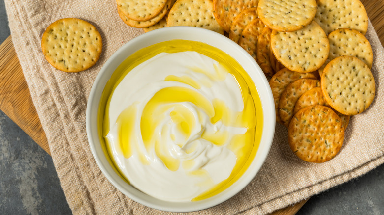 Organic whipped ricotta dip appetizer with round crackers