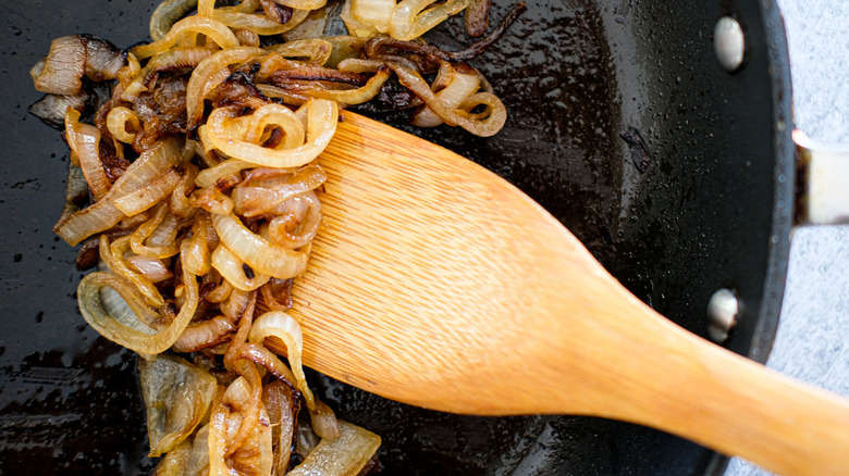 caramelized onions with wooden spatula
