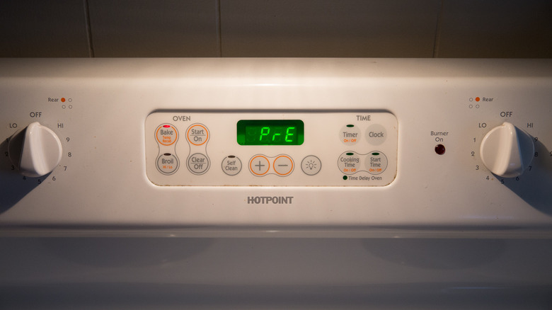 oven displaying preheating light