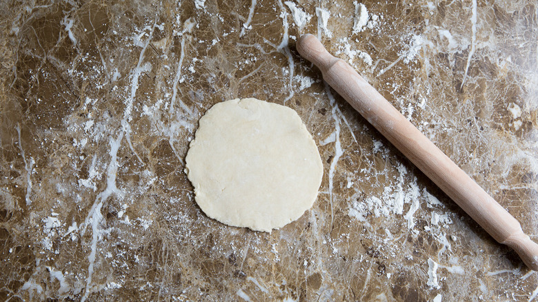 flat dough disc on counter 