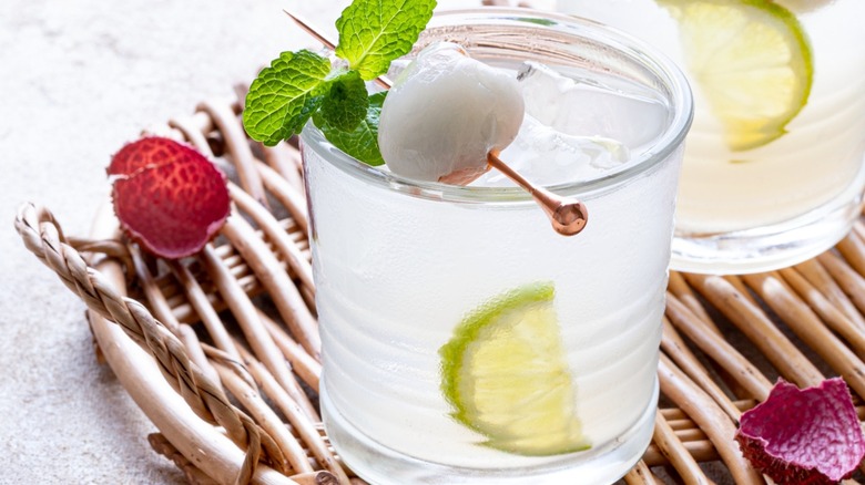 Close-up of a lychee cocktail with mint and lime