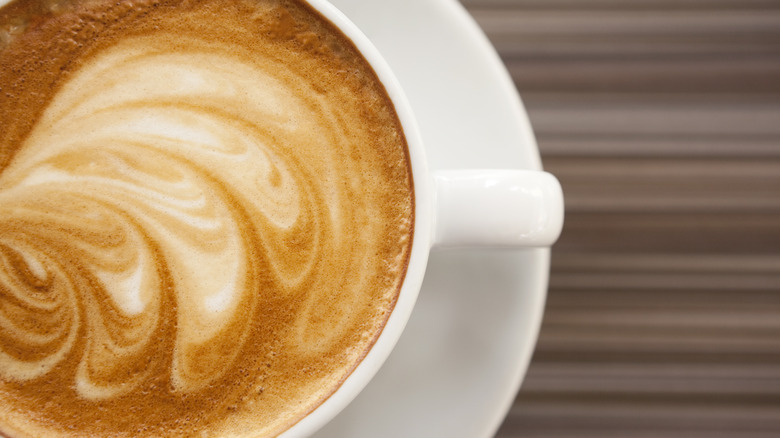 flat white coffee with leaf pattern