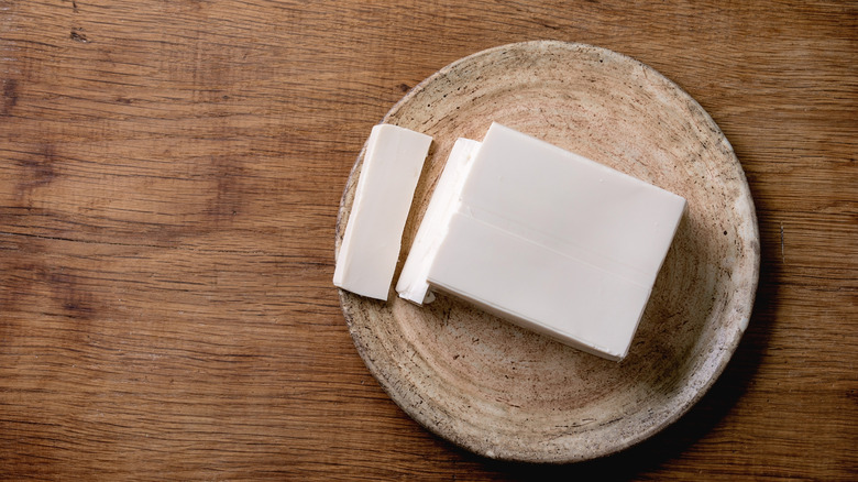 A sliced block of soft tofu on a plate