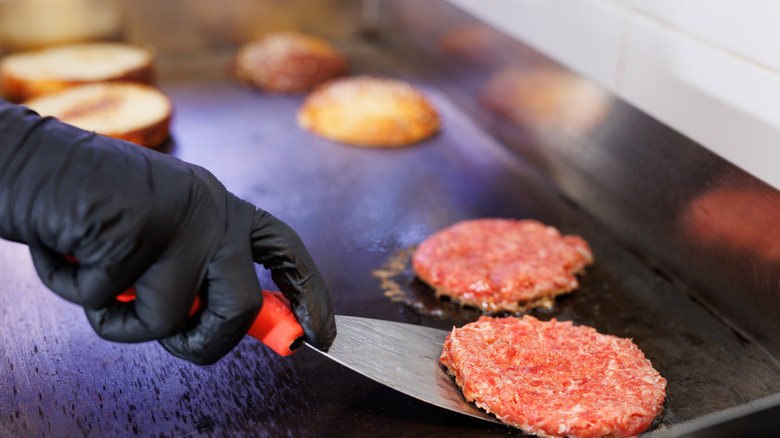 Cooking burgers on flat-top grill