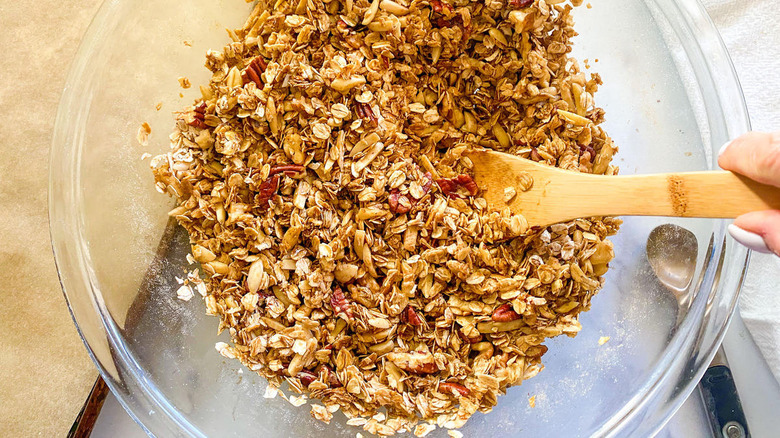 spoon stirring granola