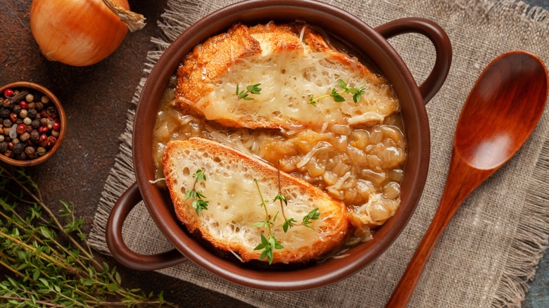 table setting with a bowl of french onion soup