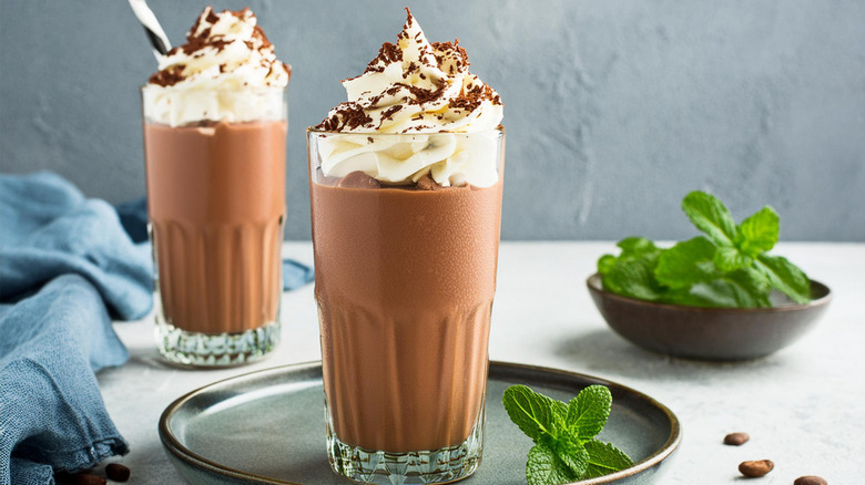 homemade chocolate milkshakes topped with cream