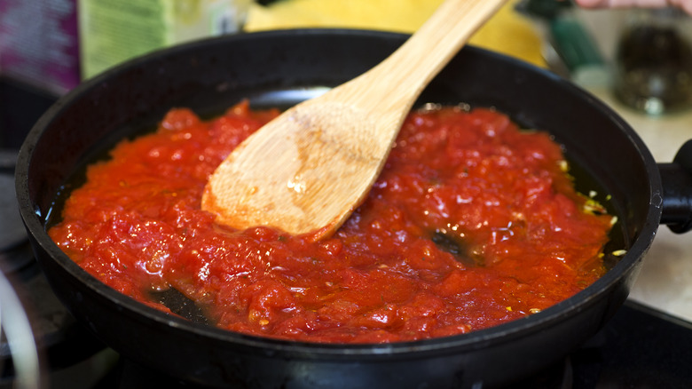 tomatoes in pan on stove