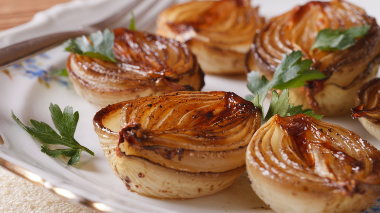 Roasted onion halves on plate