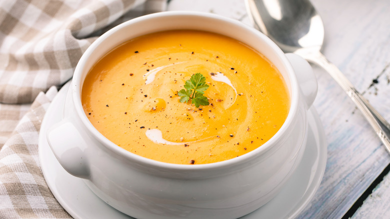 pumpkin soup in a white bowl