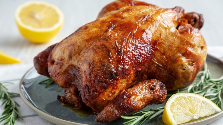A rotisserie chicken on a plate