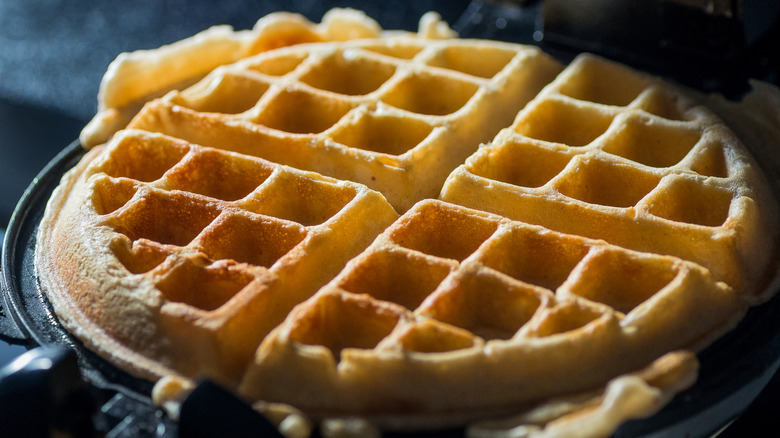 large waffle in a waffle iron