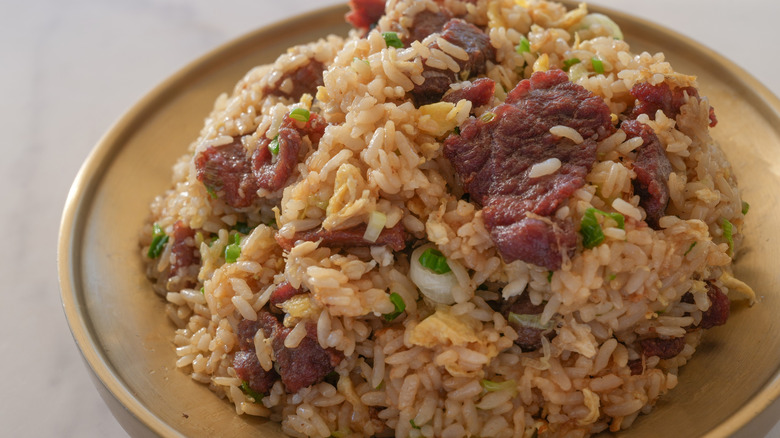 plate piled with steak fried rice