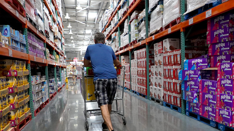 A man with shopping cart in Costco