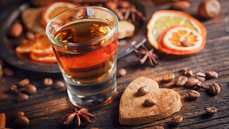 bourbon with a cookie and oranges